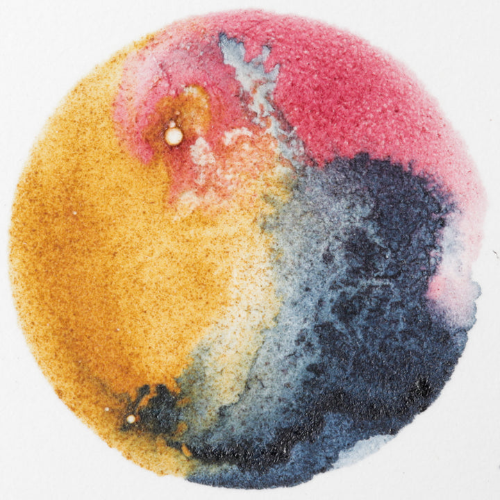 painting of circle with watercolors from natural dyes and pigments